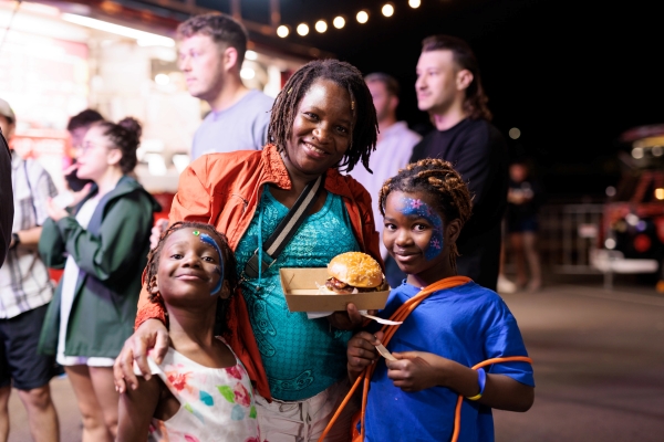 family with food at a festival