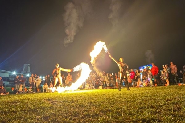 Performers with fire sticks