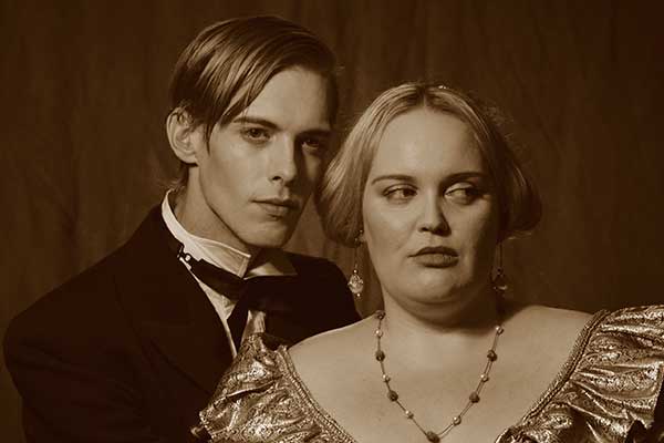 Couple in period costume posing together