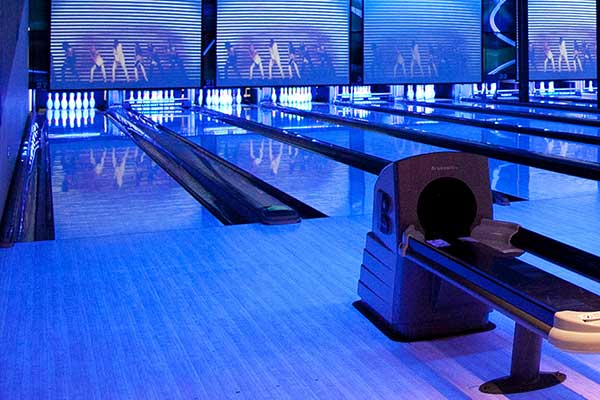 Bowling alley lit by blue lights